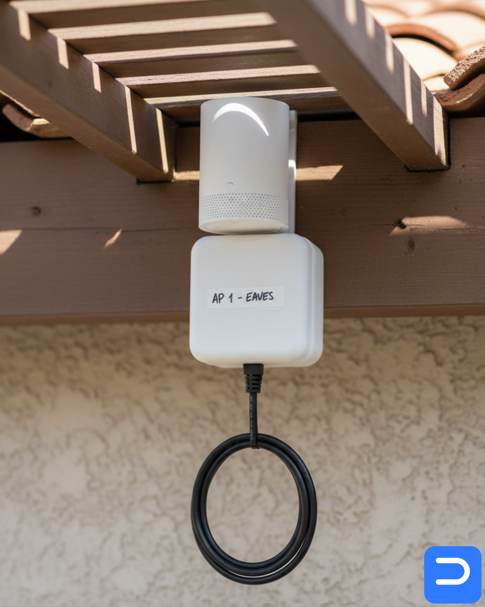 Detail: labelled mesh node under an eave, with PoE injector and clean cable run for a Stellenbosch semi-detached home